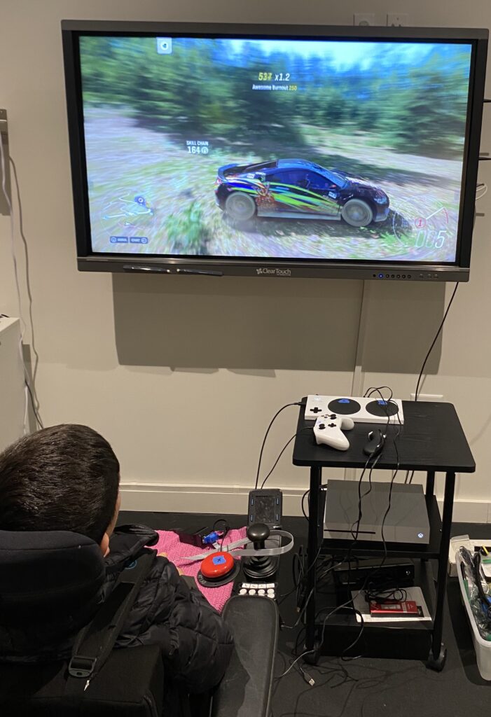 Photo of boy playing adaptive game